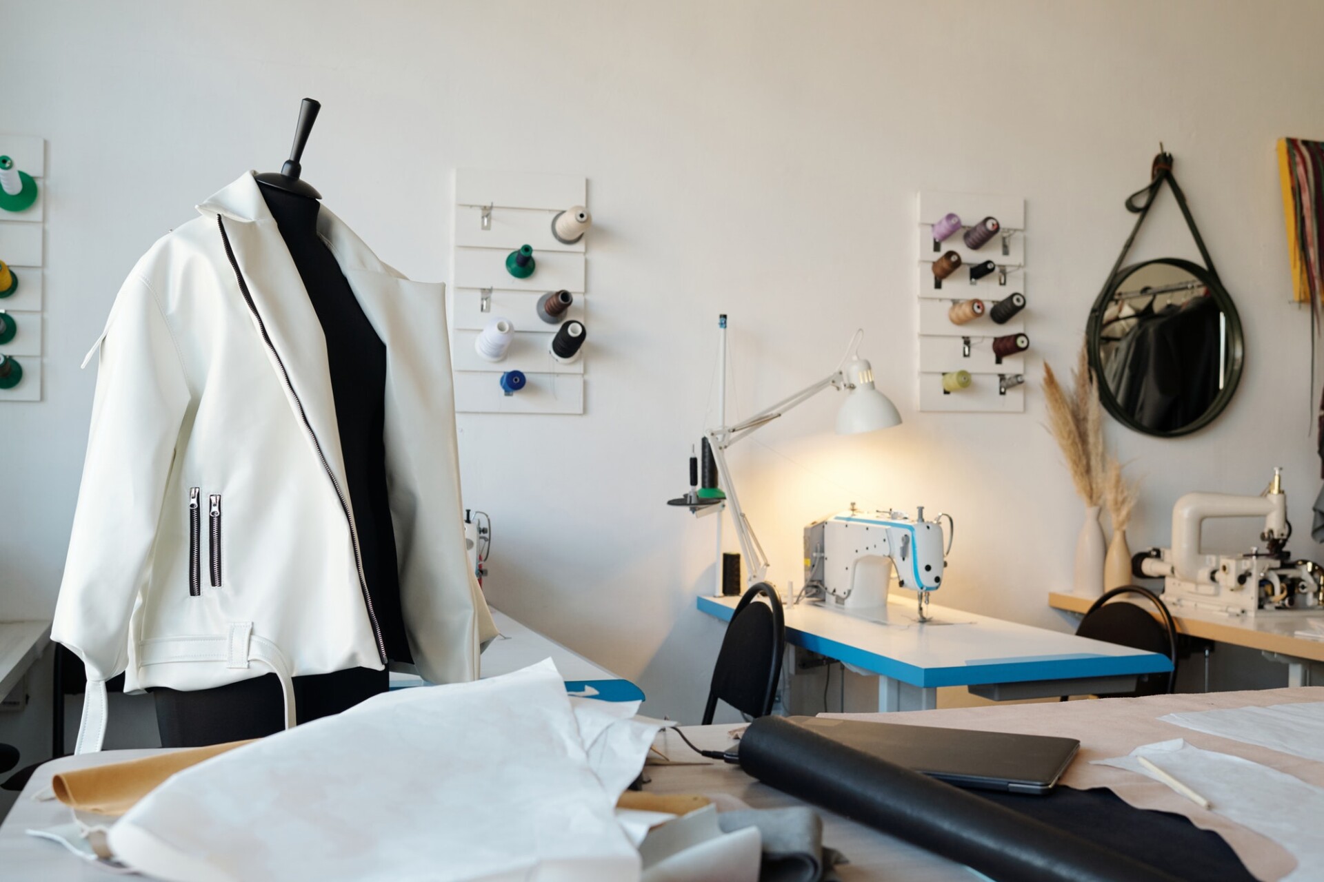 new-white-leather-jacket-on-mannequin-and-workplace-of-tailor-or-leatherworker.jpg